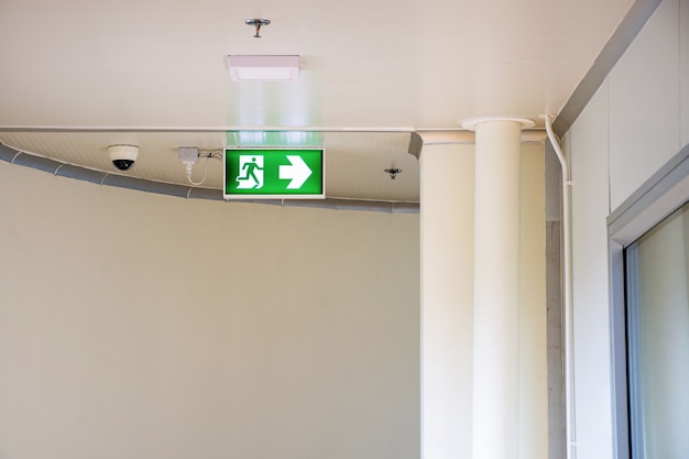 Photo emergency fire exit sign show the way to escape.