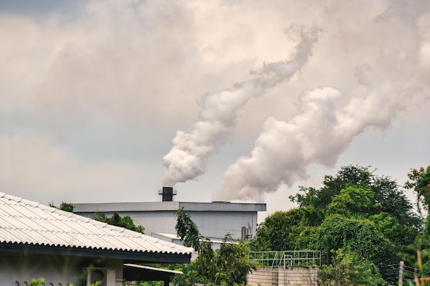 Photo emission smoke pollution to the air from industrial plant chimney environmental issues global warming climate change greenhouse effect