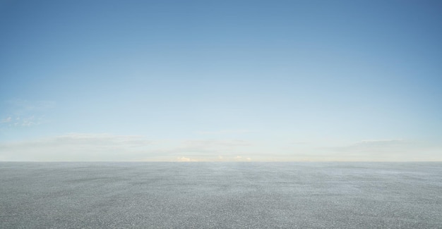 Empty asphalt floor with blue sky