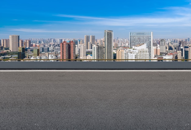 Empty asphalt road and city skyline and building landscape, China.