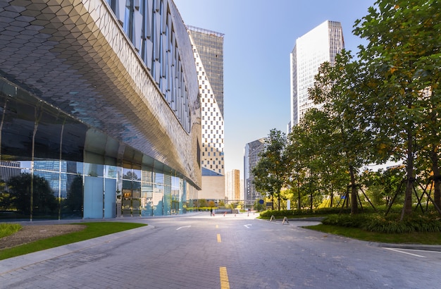 Empty road with modern city landmark buildings of hangzhou bund Skyline, zhejiang, china