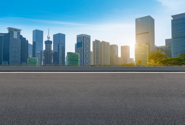 Empty road with panoramic cityscape