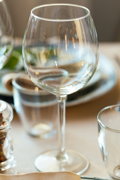 Empty wine glass on a restaurant table