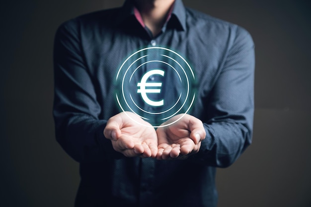 Euro icon in a circle Currency concept Man holding in his hand