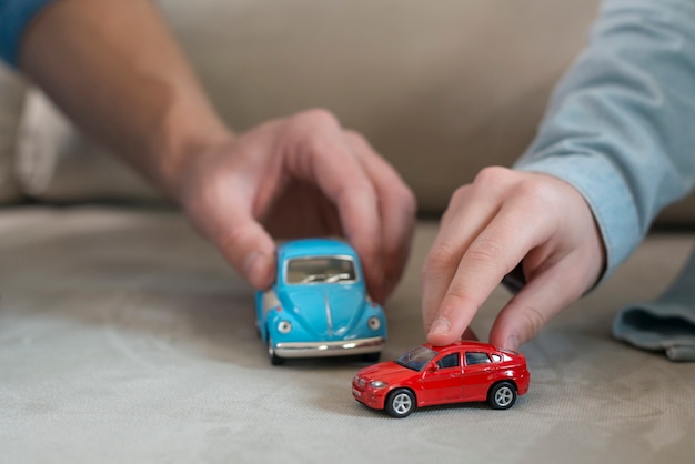 Father and son hands and toys