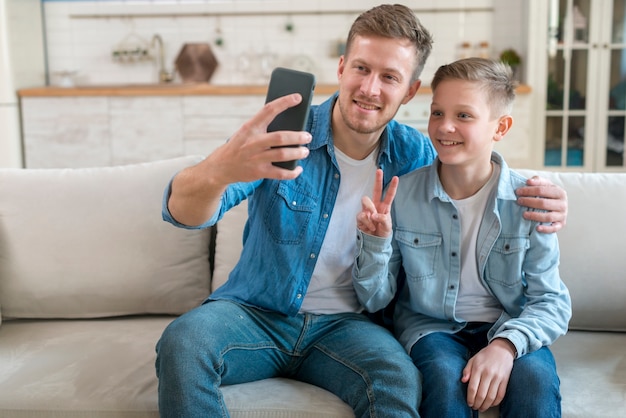 Father and son taking a photo