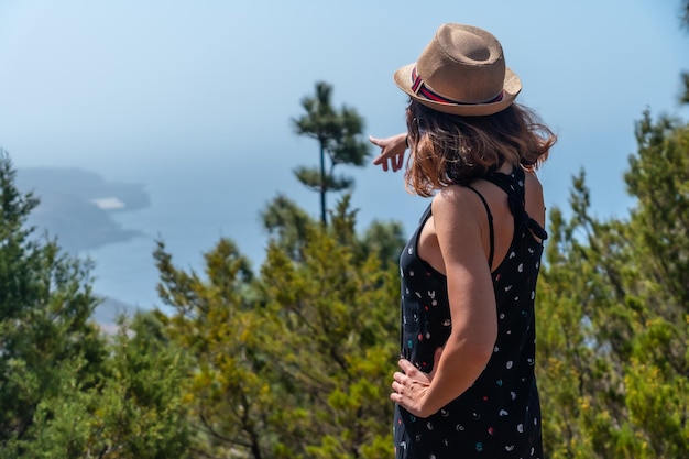 A female tourist with a hat at the El Julan viewpoint on the El Hierro Canary Islands