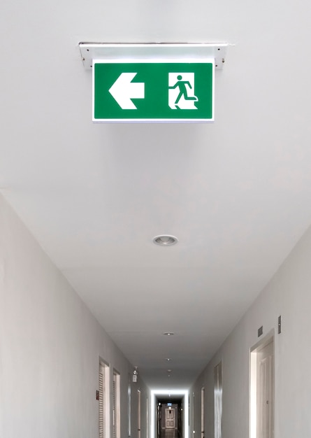 Photo fire exit sign. emergency fire exit door exit door on ceiling.