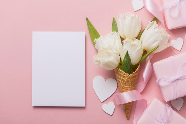 Flatlay waffle cone with white flower blossom