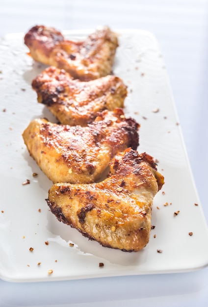 Fried chicken wings on the white plate