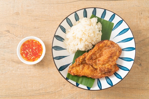 fried chicken with sticky rice and spicy sweet sauce