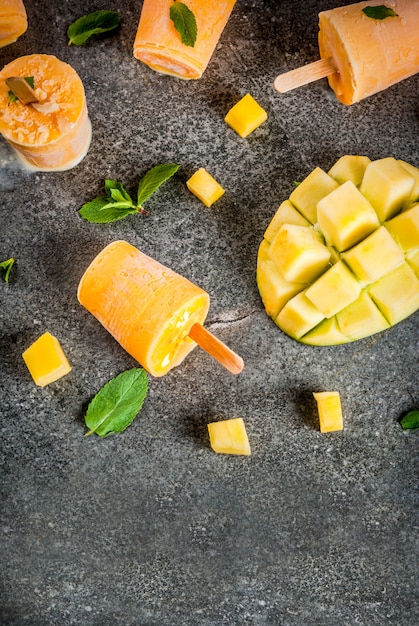 Frozen mango smoothie, with mint leaves and fresh mango fruit