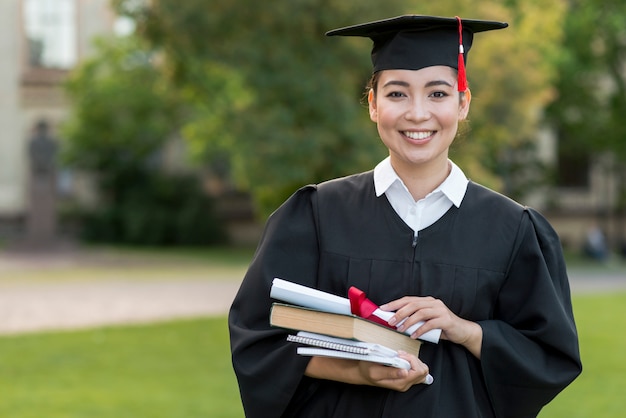 Graduation concept with portrait of happy girl