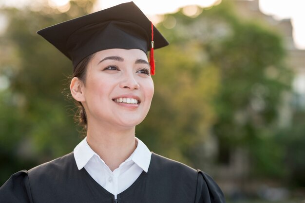 Photo graduation concept with portrait of happy girl