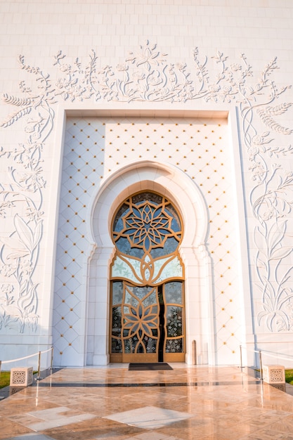 Grand Mosque in Abu Dhabi in the evening during sunset. Panorama of exterior of Sheikh Zayed Mosquein UAE.