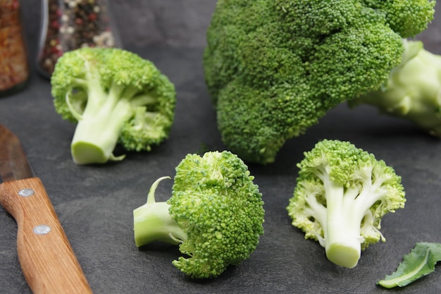 Green fresh broccoli on a black background