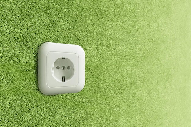 Green wall power socket. Green Power Concept