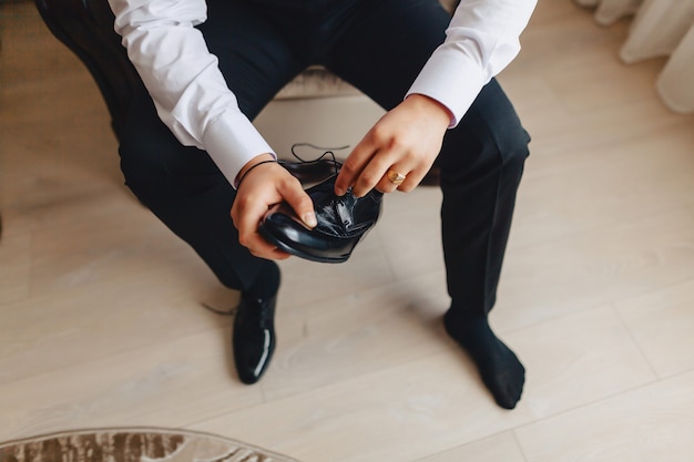 Photo groom meeting, details, jacket, shoes, watches and buttons on the wedding day