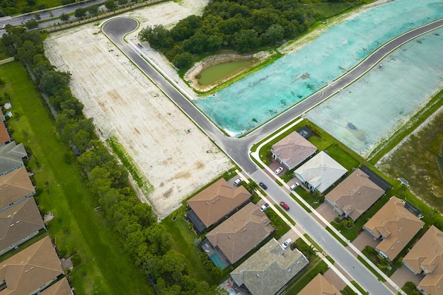 Ground prepared for building of new residential houses in Florida suburban development area Concept of growing american suburbs