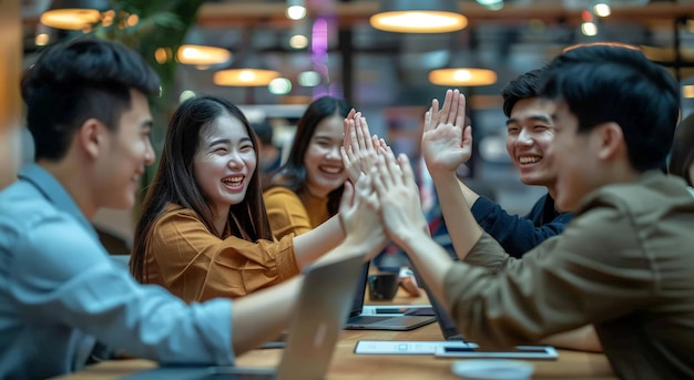 Photo a group of people with their arms raised in a restaurant