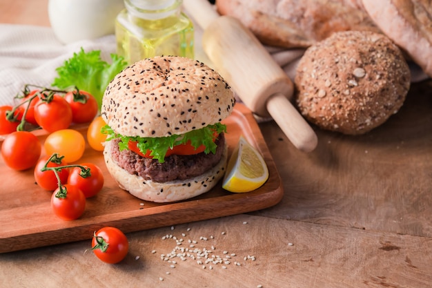 Hamburger homemade on wood table.