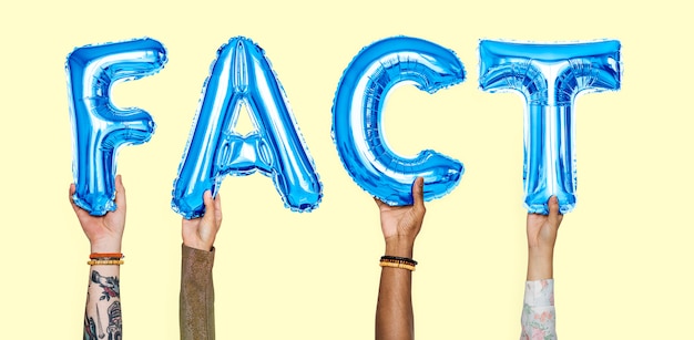 Hands holding fact word in balloon letters