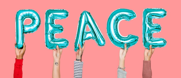 Hands holding peace word in balloon letters