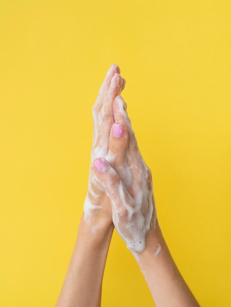 Hands washing with foam from soap