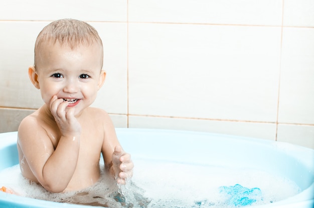 Handsome boy preschooler bathing in the bathroom clean and hygienic