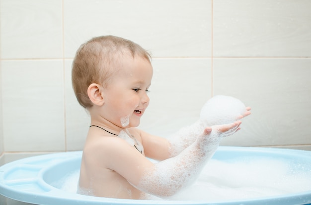 Handsome boy preschooler bathing in the bathroom clean and hygienic