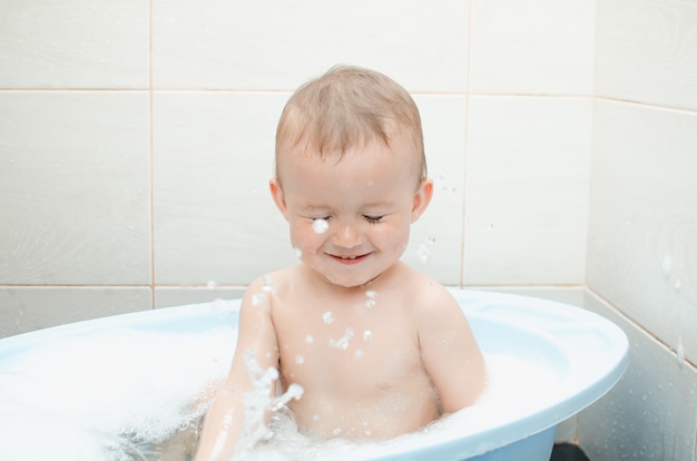 Handsome boy preschooler bathing in the bathroom clean and hygienic