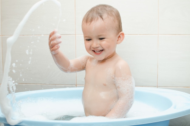 Handsome boy preschooler bathing in the bathroom clean and hygienic