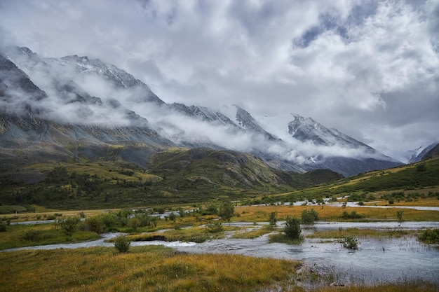 Hiking in the mountains Rivers and mountain lakes summer landscape of ridges and peaks An amazing journey