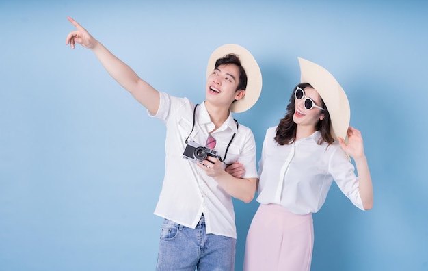 Photo image of young asian couple travel summer vacation