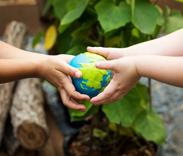 Kids holding a clay molded as 