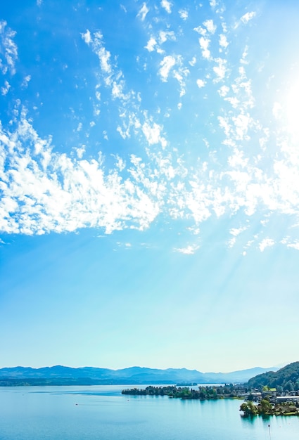 Photo lake zurich in wollerau canton of schwyz in switzerland zurichsee swiss mountains landscape blue water and sky in summer idyllic nature and perfect travel destination ideal as scenic art print