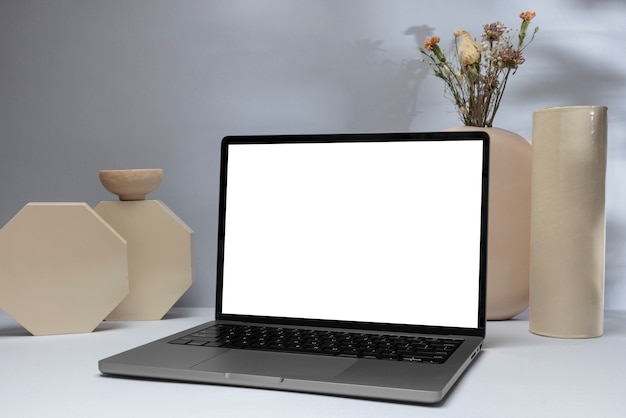 Laptop and ceramic pots assortment