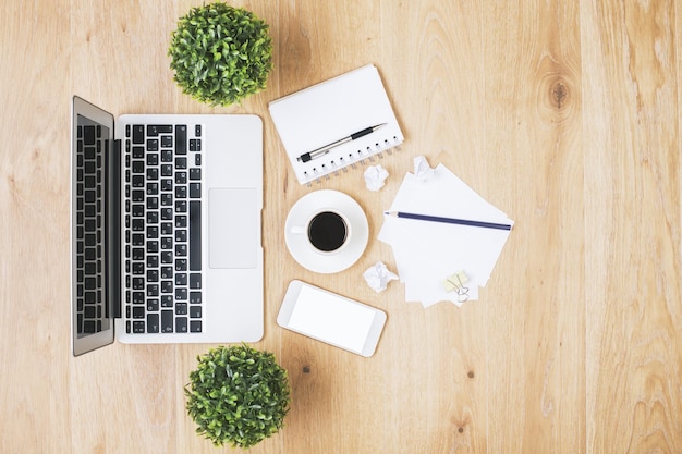 Laptop and white smartphone