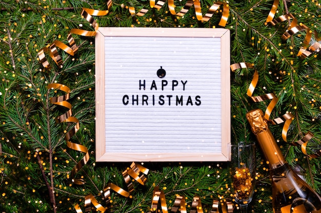 Photo letter board new year and christmas concept. top horizontal view copyspace christmas decorations and fur tree.