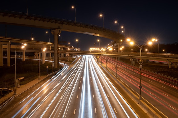 Long exposure light trals on a modern speedway Above view