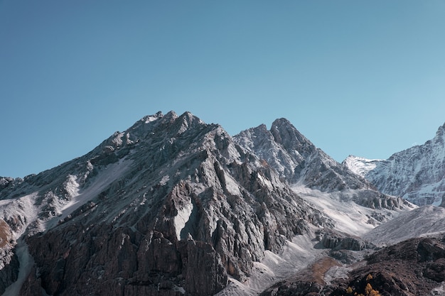 Majestic limestone mountain shining with blue sky in morning