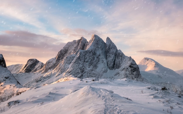 Majestic mountain range with snowfall at sunrise morning