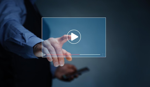 Man holding tablet and watching video