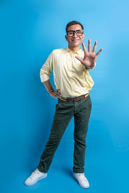 Man with eyeglasses and a shirt wearing a rainbow bracelet