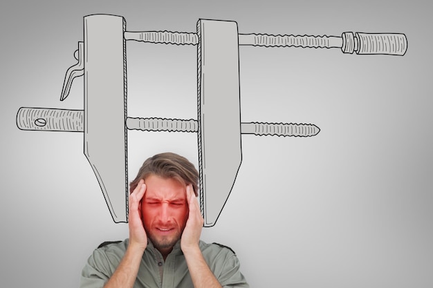 Man with headache against grey vignette