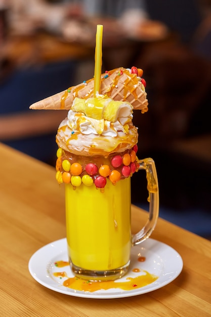 Marshmallow milk shake cocktail with whipped cream, cookies, waffles, treats