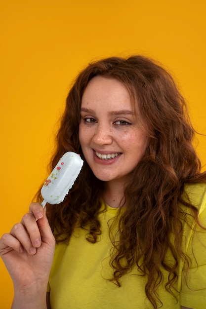 Medium shot young woman with ice cream