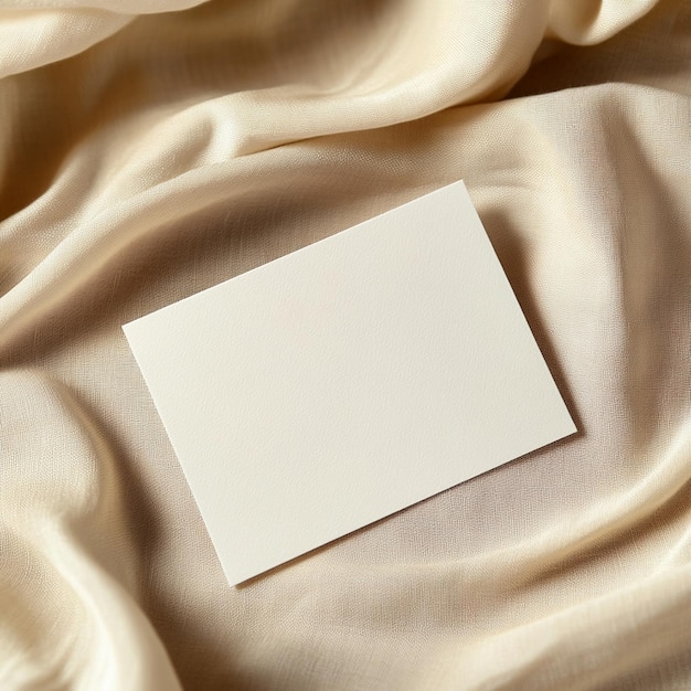 Photo minimalist blank card on beige fabric with dried flowers