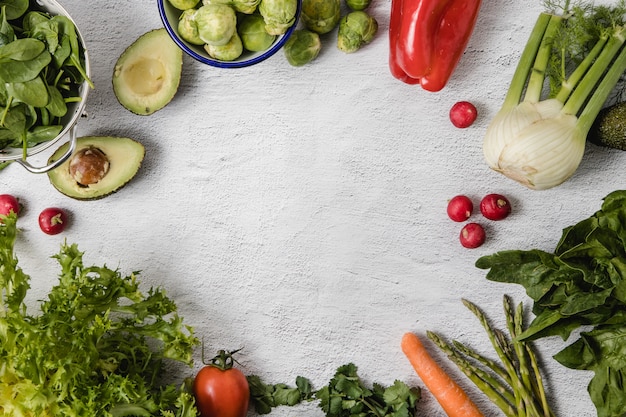 A mix of seasonal vegetables arranged over a white background