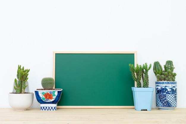 Mockup of frame poster and cactus pot, interior background